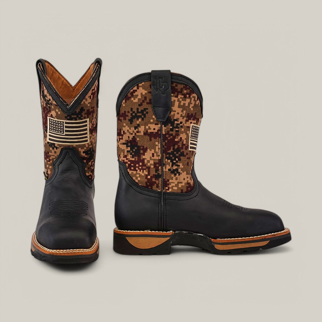 The Crazy Black Soft Toe - E6185 cowboy boots feature a black leather foot, camo upper, and an American flag patch. With a pointed toe, brown stitching, black soles, and a side pull-tab, they expertly combine durability and style.