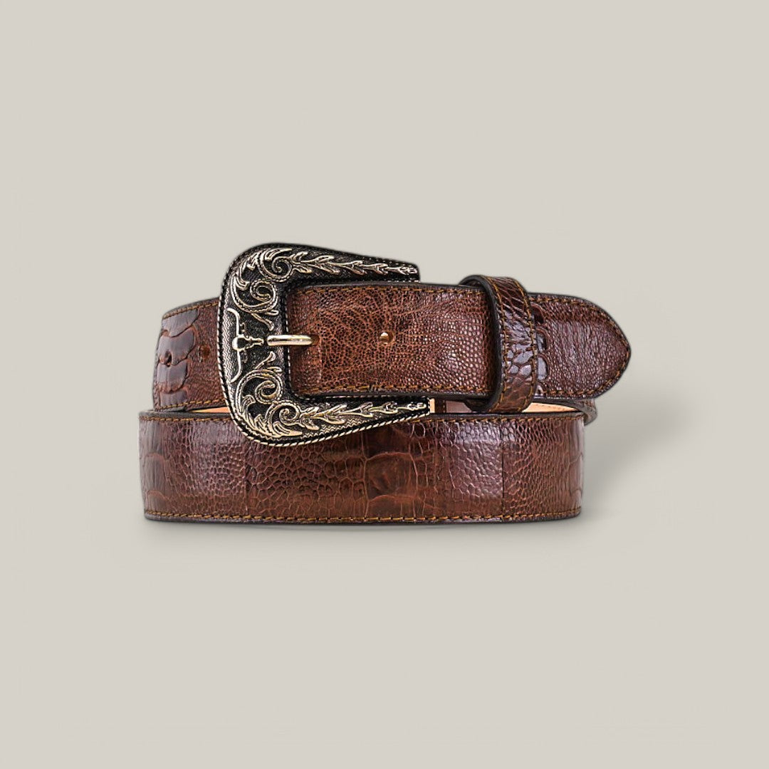 The Exotic Full Quilt Ostrich Leg- Texas Buckle - Brown Belt is displayed coiled on a plain background. This luxury accessory features a decorative silver buckle with intricate designs inspired by the iconic Texas Buckle Belt style.