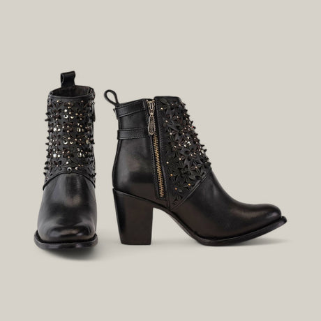 The Black Laser & Crystals - Round Toe - CU439 boots feature black ankle-length design with floral embellishments, sparkling crystals, metal studs, chunky heel, side zippers, and a pull tab. Showcased on a gray background, they embody Cuadras elegance.