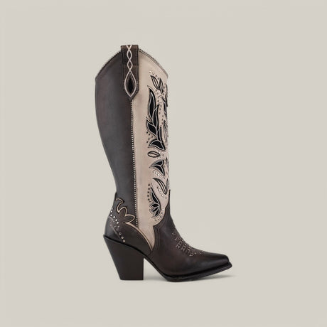 The CU781 is a tall cowboy boot featuring black and white leather, intricate Tokio Gray embroidery, decorative stitching, a pointed snip toe, chunky heel, and subtle stud accents against a plain background.