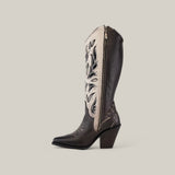 The Tokio Gray Embroidery & Cut Out & Studs CU781 is a tall black cowboy boot featuring intricate embroidery, a side zipper, snip toe design, angled chunky heel, and eye-catching stud accents on a neutral background.