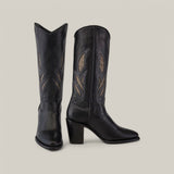 A pair of Black Embroidery - Round Toe - CU874 cowboy boots in tall black leather features decorative leaf-shaped embroidery on the shafts, with tan and grey hues against a light gray background, and chunky heels for added elegance.