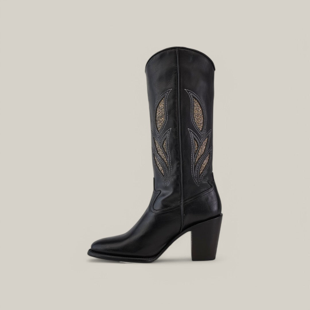 A Black Embroidery - Round Toe - CU874 cowboy boot in black leather features intricate lighter thread embroidery on the shaft and a chunky heel, set against a plain light gray background.