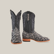 A pair of Exotic Piraruco Fish boots in Rustic Bone, featuring textured scales on the lower part and intricate embroidery on the upper shaft, with a wooden heel, set against a plain background.