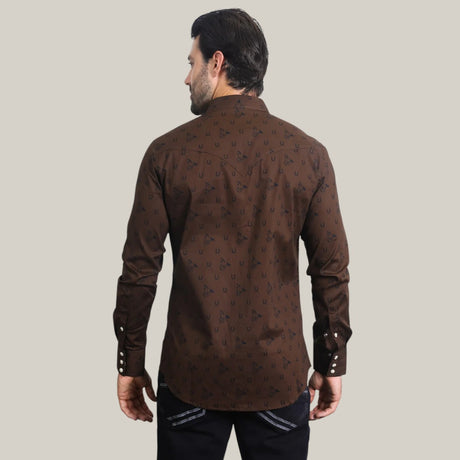 Against a light background, a man with dark hair contrasts in a Mens Western Modern Fit Spandex Long Sleeve Brown Shirt with Snaps - WPL10487. Facing away, the shirts subtle pattern and pointed collar add style, while the buttoned cuffs offer refinement.