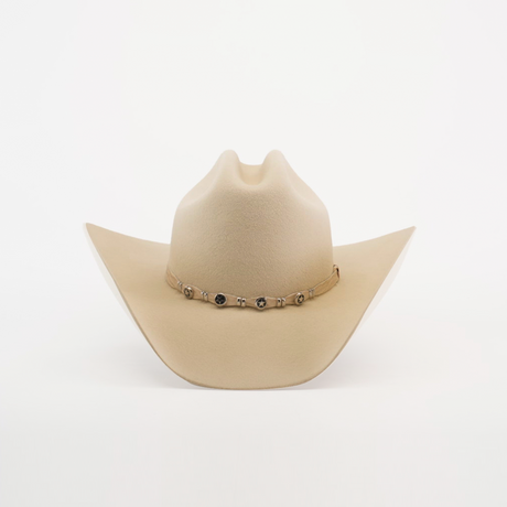 The 6X Country Bone is a Western classic cowboy hat made from premium beige sheep wool felt, featuring a wide brim with a decorative band adorned with small metal accents on a plain white background.