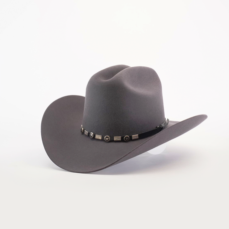 The 100X Sinaloa Oxford is a gray cowboy hat made from soft sheeps wool, featuring a wide brim and a black band with silver conchos. It captures Western heritage beautifully, set against a white surface on a plain background.