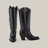 From the Platinum Collection, the Francia Rings Tall Shaft Black - J Toe cowboy boots boast stylish details like a visible side zipper on the right boot and a decorative chain on the left. With tall shafts, pointed toes, and chunky heels, these black leather boots are true standouts.