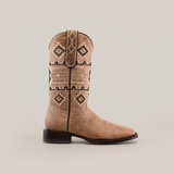 The Palles Aztec Stitch Fawn boot features intricate Aztec-inspired stitching in brown and black on a tan short shaft. It has a classic western style with a square toe, genuine leather sole, and is displayed against a plain white background.