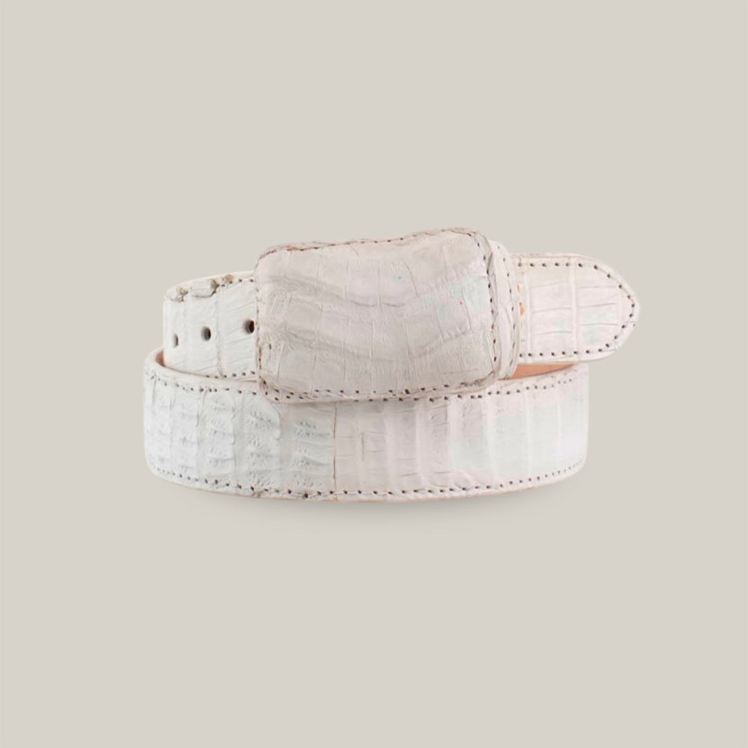 The Exotic Full Quilt Caiman - White Belt features a crocodile-like pattern with a textured design and a rectangular buckle. Displayed coiled against a plain white background, it showcases its craftsmanship beautifully.