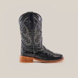 The Karoo Ostrich Print Black Square Toe cowboy boot features premium cowhide leather with intricate western stitching, a textured shaft design, smooth brown wooden sole, and square toe, all showcased on a white background.