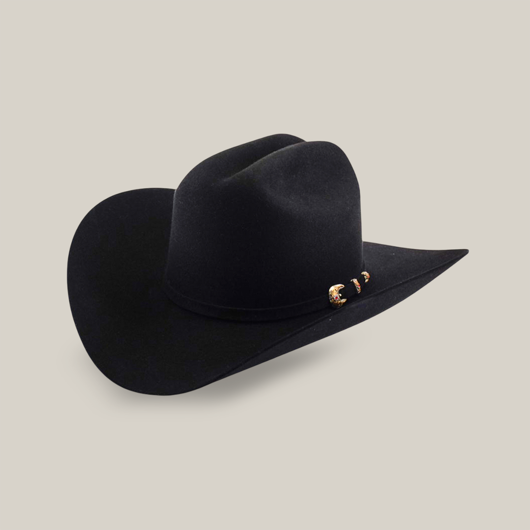 The 6X Real Black cowboy hat is made from premium fur felt with a wide brim and curved edges. Decorated with silver and gold accents on the band, this Larry Mahan creation elevates classic western style with elegance.