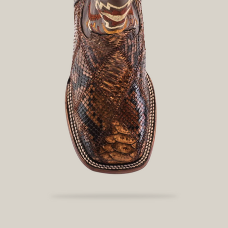 Close-up of the Exotic Python Patchwork Brown Square Toe boot, crafted from a textured brown and tan python leather with intricate scales and smooth accents, showcasing exceptional craftsmanship.