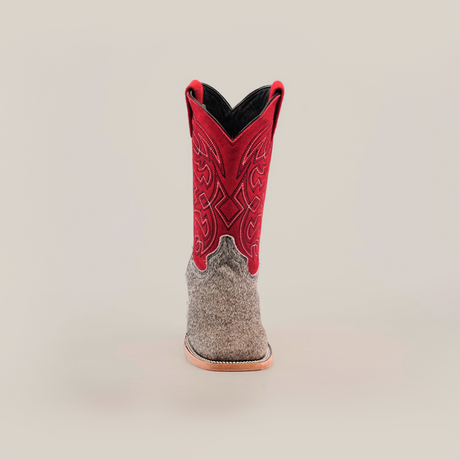 A single Cowhide Hair Pinto Square Toe boot features a gray textured foot and vibrant red shaft with intricate stitching. The stylish square toe design is complemented by a visible brown sole, all set against a plain white background.