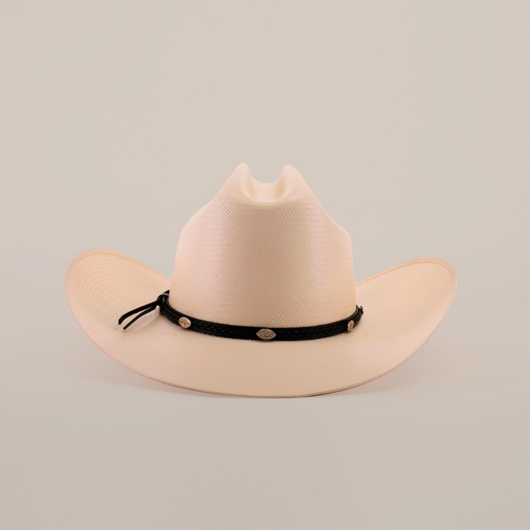 The 500X Sinaloa Straw Hat, a beige cowboy hat with a wide brim and a black band adorned with small emblems, showcases timeless style against a plain white background.