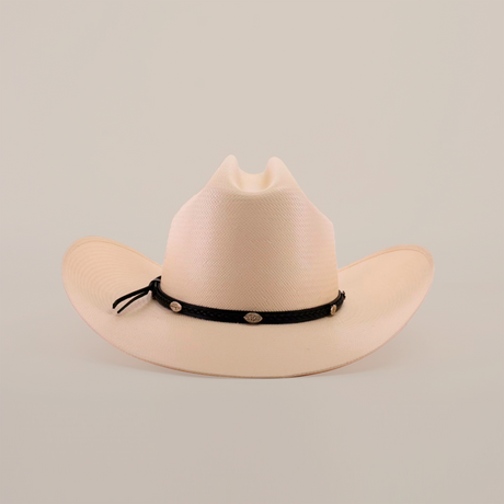 The 500X Sinaloa Straw Hat, a beige cowboy hat with a wide brim and a black band adorned with small emblems, showcases timeless style against a plain white background.