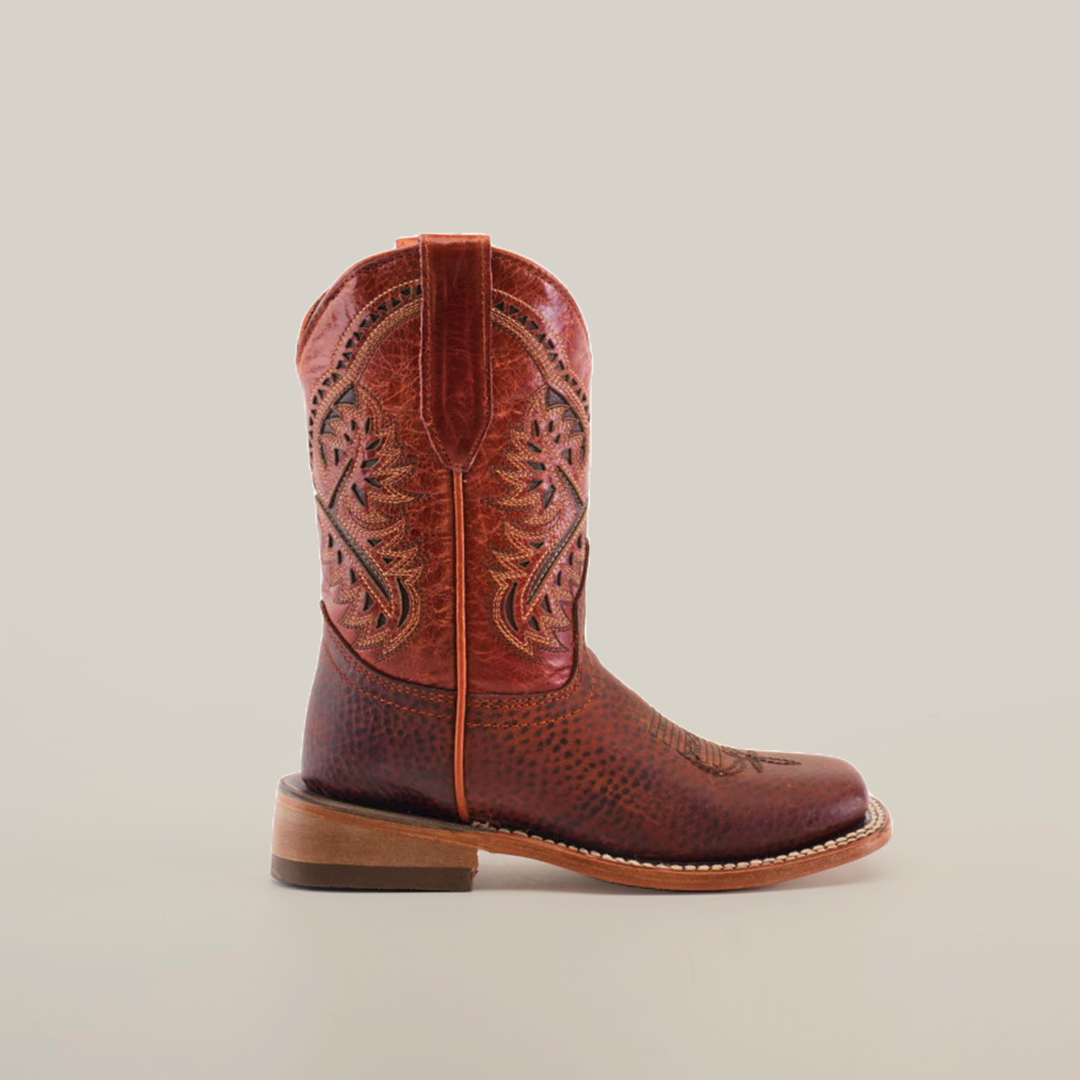 The Cheyenne Shedron Square Toe boot has intricate shaft stitching, a sturdy heel, and a textured brown leather surface made from genuine cowhide. Displayed against a plain white background, it epitomizes classic western footwear style.