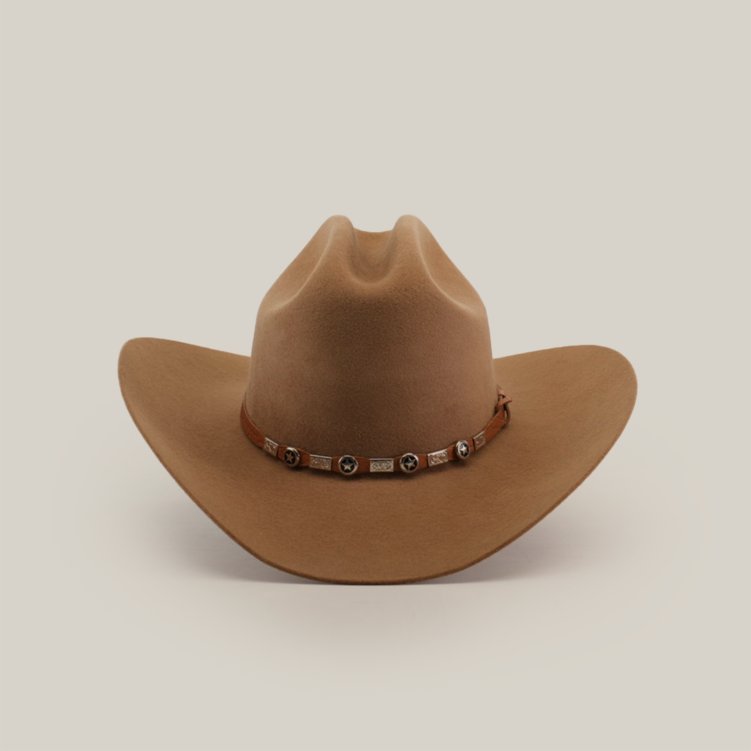 The 6X Sinaloa Fawn, a brown cowboy hat made from authentic sheeps wool and adorned with a decorative band of metal embellishments, stands against a plain white background, capturing the essence of Western heritage.