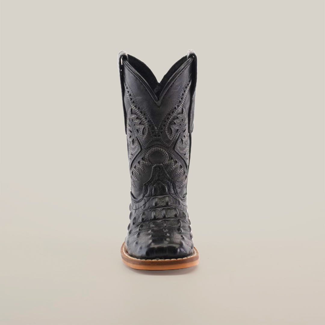 A front view of the Caiman Hornback Print Black Square Toe boot showcases its meticulously handcrafted black leather with ornate stitching, against a plain white backdrop. It features a pointed toe, premium leather with Caiman Hornback print, complemented by a light brown sole and high shaft.