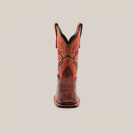 Positioned against a white background, the Azkar Moka Square Toe cowboy boot in brown features decorative stitching on the shaft and a square toe, crafted from premium materials with intricate patterns in darker leather tones.