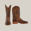 The Azkar Tan boots, with square toes and slip-resistant soles, crafted from premium cowhide, feature intricate shaft stitching. One boot stands upright while the other turns slightly to showcase the wooden heel. Both are set against a plain background.