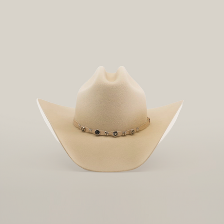 The 6X Country Bone is a Western classic cowboy hat made from premium beige sheep wool felt, featuring a wide brim with a decorative band adorned with small metal accents on a plain white background.