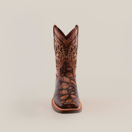 The Loggerhead Turtle Print brown Rodeo Toe cowboy boot boasts a detailed design with intricate shaft patterns and a rugged foot texture, all crafted from premium cowhide leather and showcased against a plain white background.