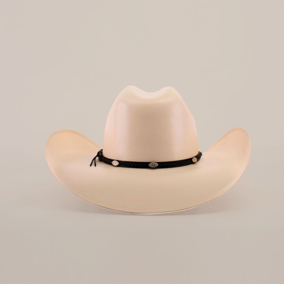 The 1000X Chihuahua Straw Hat, a cream-colored cowboy hat with a wide brim and black braided band featuring metal accents, makes a bold fashion statement. Made from durable materials, this striking piece is showcased against a plain white background.