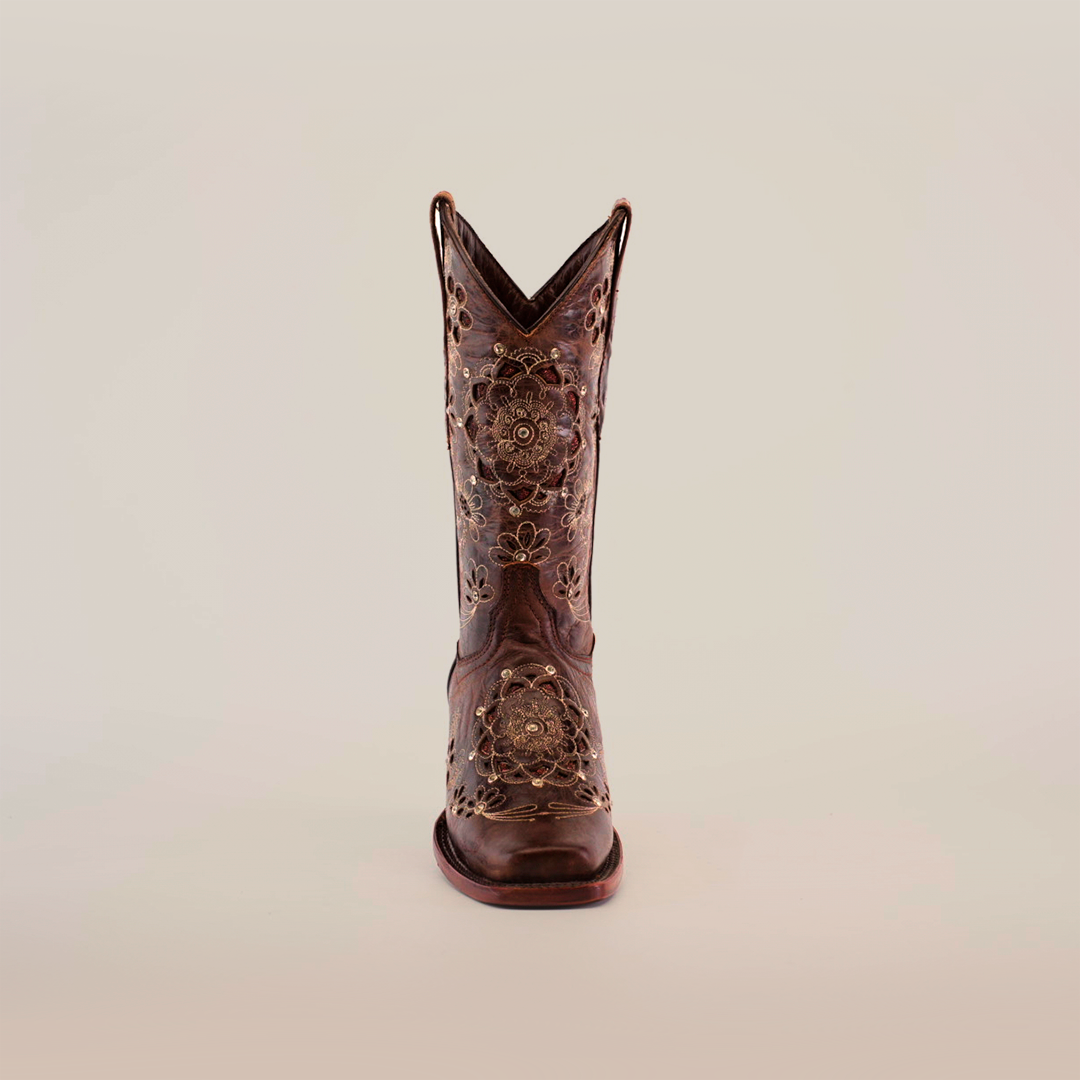 A Mayan Flower Crystals Chocolate - Short Shaft - Narrow Square Toe Boot, embellished with intricate floral embroidery and decorative cutouts, stands upright against a plain white background.