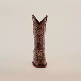 A Mayan Flower Crystals Chocolate - Short Shaft - Narrow Square Toe Boot, embellished with intricate floral embroidery and decorative cutouts, stands upright against a plain white background.