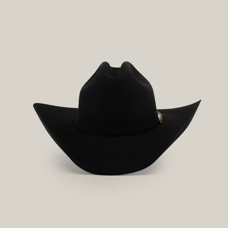 The 100X Tony Lama Black is a premium beaver fur cowboy hat with a wide brim and a decorative silver emblem on the band, epitomizing authentic Western elegance against a plain white background.