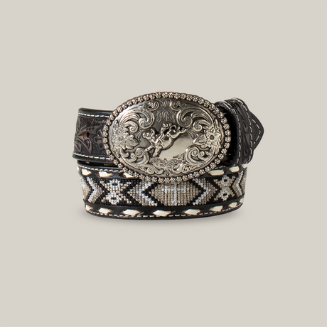 The Nocona Western Belt Boys Cross Inlay Embroidered Laced Black (N4441601) is a black leather belt with a large ornate silver buckle adorned with floral patterns and Western-inspired designs, featuring stitched patterns in black, white, and gray for a rustic touch.