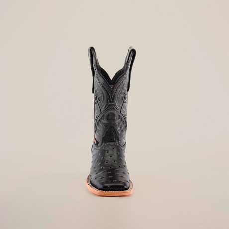 The Karoo Ostrich Print Black Square Toe boot is highlighted against a plain white background, showcasing its luxurious design with intricate stitching, a square toe, slightly raised heel, and elegant ostrich print patterns on the shaft for added sophistication.