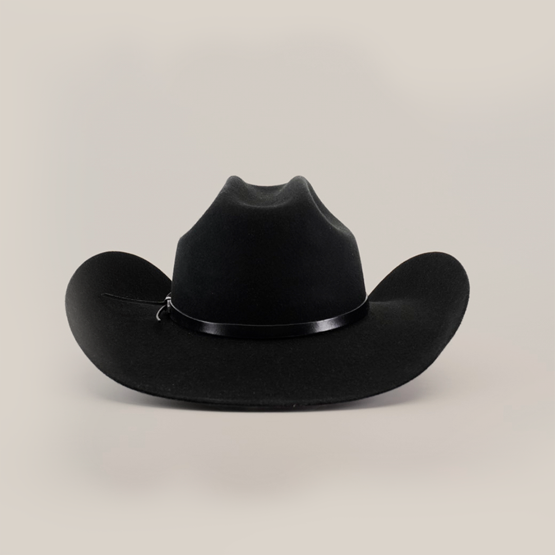 The 6X Bull Black cowboy hat, with a wide brim and slight crown crease, highlighted by a thin black band, is centered against a plain white background.