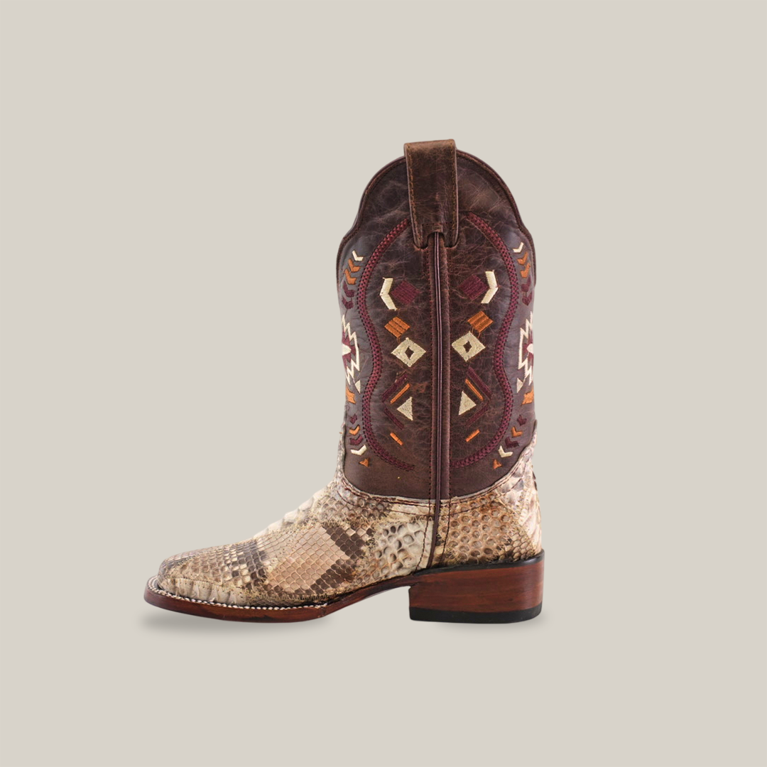 The Exotic Python Patchwork Natural Square Toe boot displays a patterned shaft with geometric red, yellow, and brown designs. Made from premium python leather, the foot has a beige and brown snakeskin texture and features a natural square toe against a plain white backdrop.