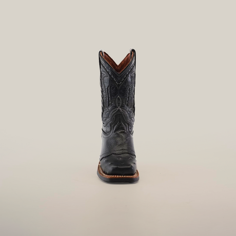 The Karoo Ostrich Half Cowhide Print Black Rodeo Toe boot is featured in a front view against a plain white background, highlighting its luxurious ostrich leather and intricate stitching details.