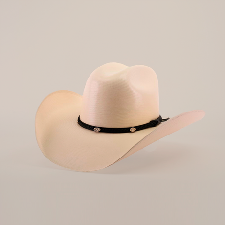 The 1000X Chihuahua Straw Hat is a durable beige cowboy hat with a wide brim, featuring a black band with silver buttons. Crafted from premium materials, it makes a bold fashion statement against the plain white background.