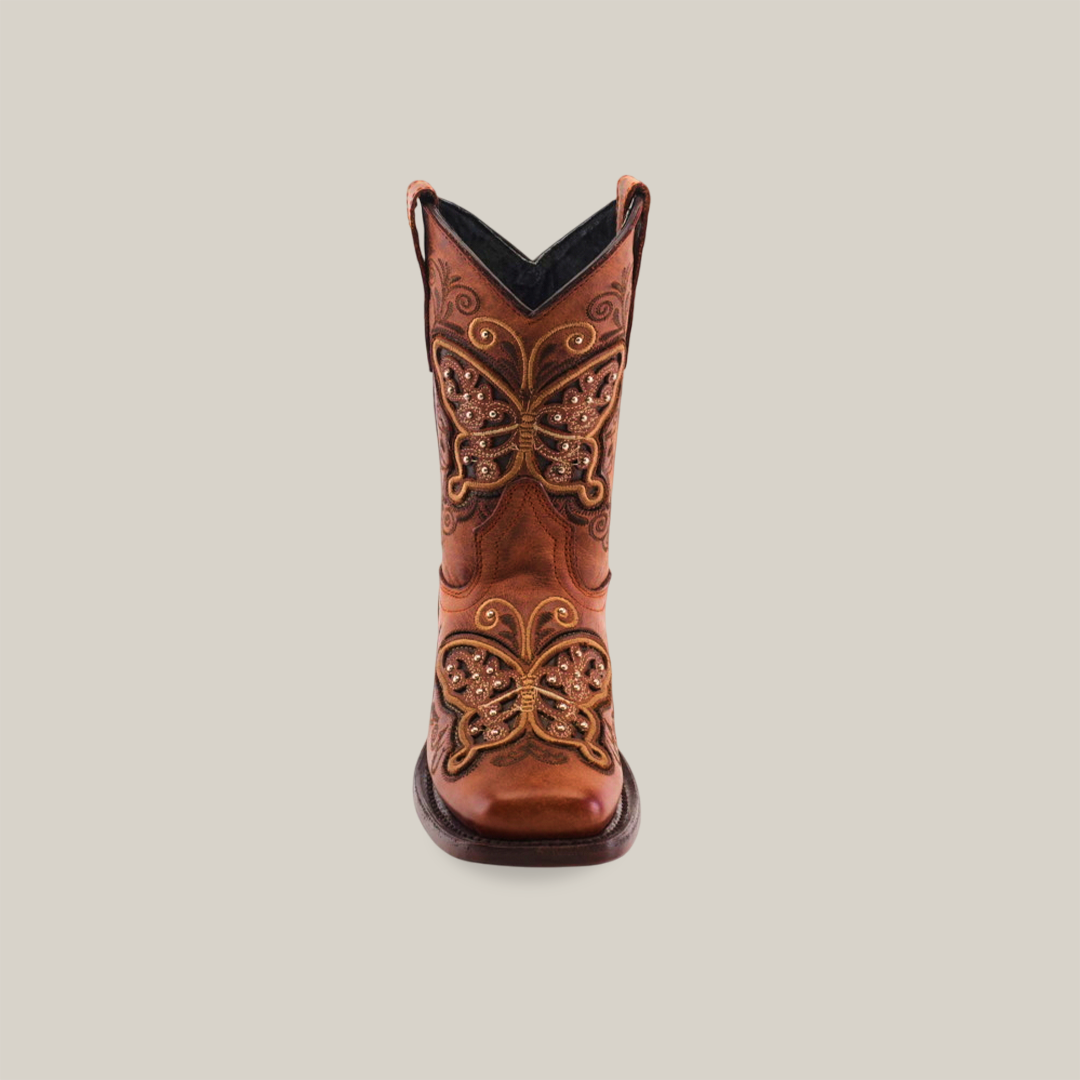 A single brown cowboy boot, crafted from cowhide leather with intricate butterfly embroidery and decorative stitching on the front, is set against a plain white background. This is the Butterfly Studs Cogñac - Square Toe.