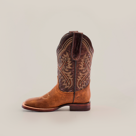 The single brown cowboy boot, featuring detailed stitching and a leather tab on top, showcases exceptional craftsmanship. It resembles the Cater Honey Square Toe boots, crafted from premium leather and set against a white backdrop.