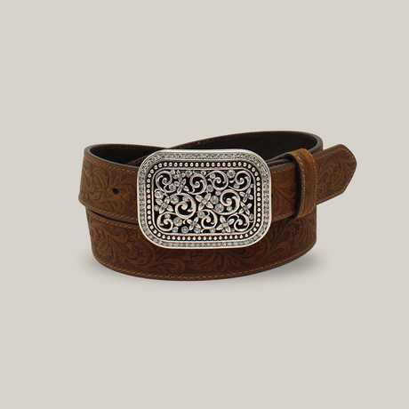 The Ariat Womens Brown Rhinestone Filigree Belt A10006944 features a coiled brown leather design with an ornate silver buckle, intricate swirling patterns, and embossed floral designs, showcasing a distinct western style perfect for womens belts.