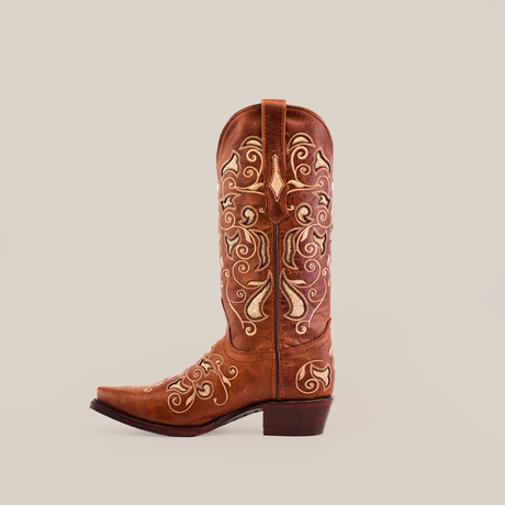 The Nataly Brown - Mid Shaft - Snip Toe boot is handcrafted by artisans, features premium leather, intricate white floral embroidery on brown leather, a pointed toe, and a stacked heel, all set against a plain white background.