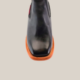 Experience luxury with the Napa Black Square Toe shoe, featuring polished black leather, a wooden sole, and precise stitching that crafts an elegant silhouette.