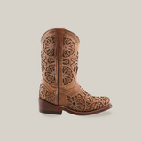 The Vitralli Studs Fawn Snip Toe cowboy boot features intricate floral cut-outs, a snip toe design, and premium leather. It has brown stitching, a low wooden heel, and stands elegantly against a white background.