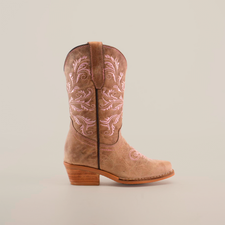 The Bellere Fawn - Snip Toe boot is expertly handcrafted from premium cowhide leather, boasting a tan design with decorative pink stitching on the shaft, a snip toe, and a wooden heel, all showcased against a pristine white background.