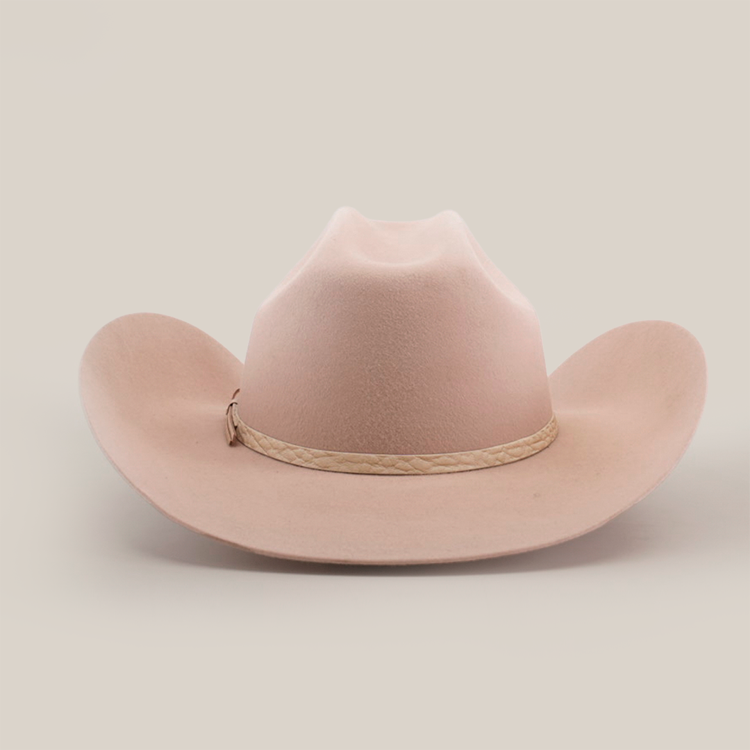 Discover the allure of the 6X Bull Belly, a luxurious tan cowboy hat with a wide brim and braided band around the crown, beautifully presented against a plain white background.