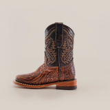 The Handtooled Leave Brown Square Toe is a single side-view cowboy boot crafted from premium cowhide leather, featuring intricate stitching and design on a white background.