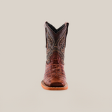 A handcrafted cowboy boot, the Caiman Belly Print Chocolate Square Toe, is centered on a white background, showcasing its premium dark stitched shaft and textured brown leather toe. The light brown sole stands out with its detailed stitching.