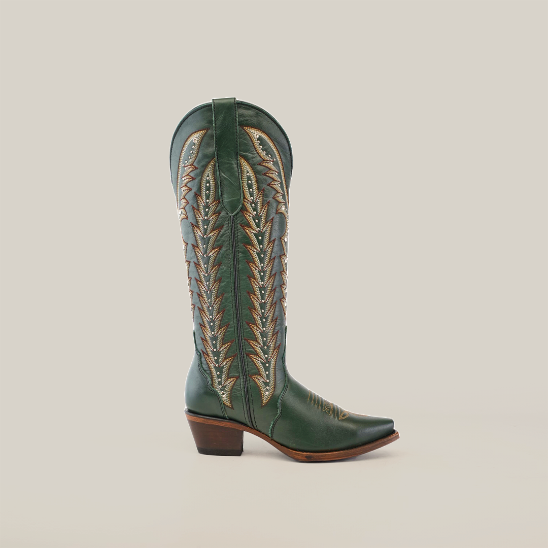 Introducing the Madona Forest Green boots: handcrafted, knee-high with a tall shaft and snip toe. Made from premium leather, they feature intricate stitching patterns and a wooden heel, all elegantly showcased against a plain white background.