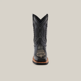 Front view of the Barcelona Black Lustre Rodeo Toe cowboy boot with intricate stitching on premium cowhide leather. It features a wide square rodeo toe, brown sole, and a high shaft with decorative patterns against a plain white background.