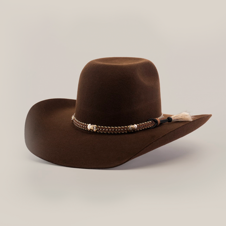 The 6X Brazil Brown is a felt hat with a Western flair, featuring a wide brim and a decorative band with beads and tassel, set against a plain white background.